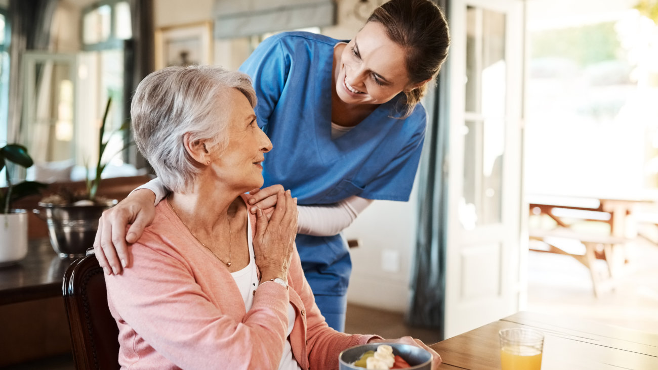 senior patient talking with the staff