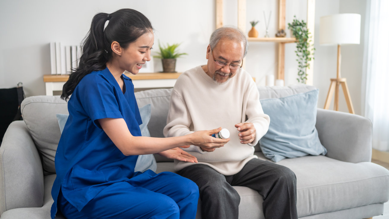 caregiver assisting senior patient