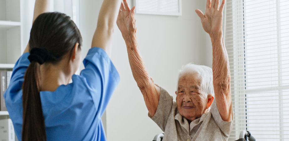 senior patient assisted by the caregiver