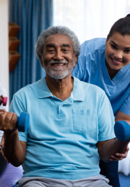 Shot of a young nurse caring for an elderly patient in a wheelchair