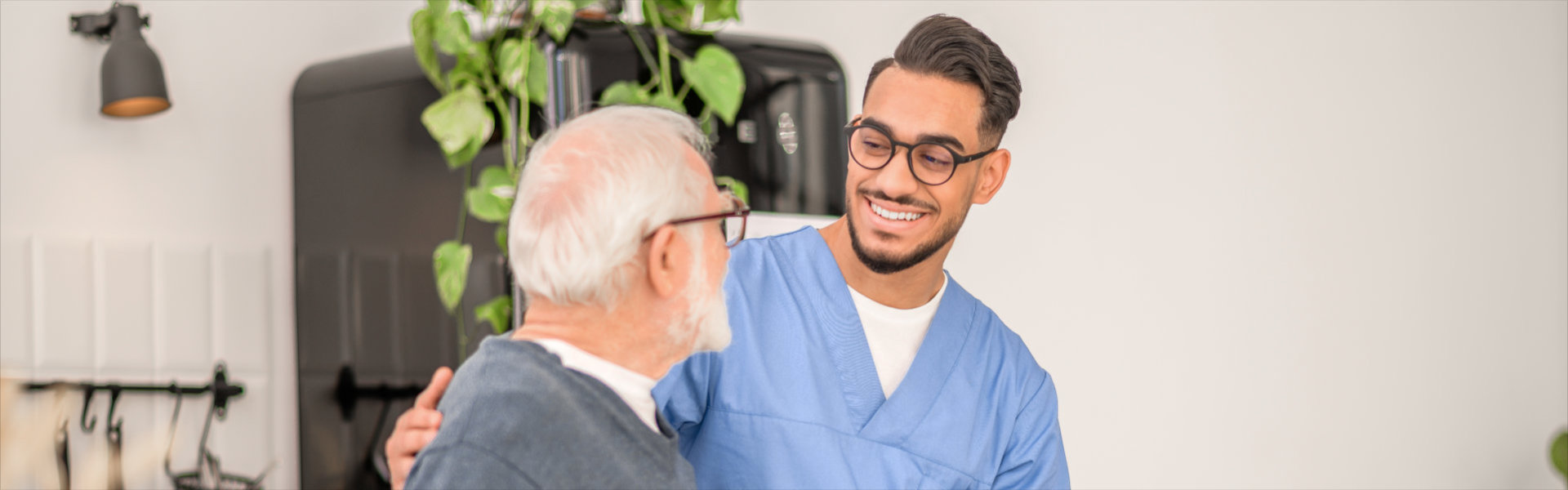 Nurse assisting a patient to walk with a walking stick