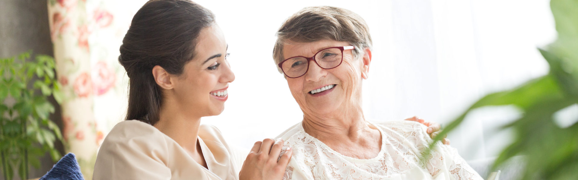 senior woman and the caregiver smiling